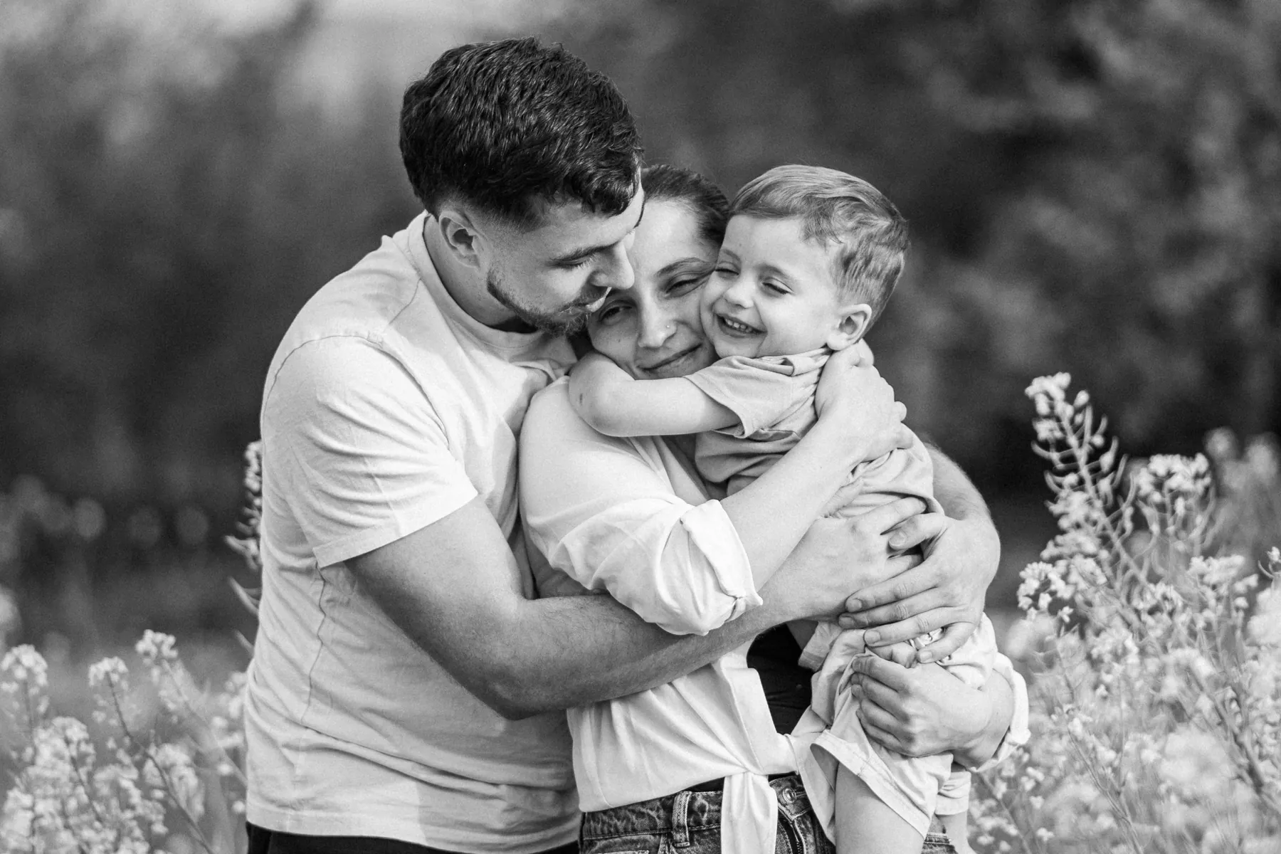Family hugging, in black and white