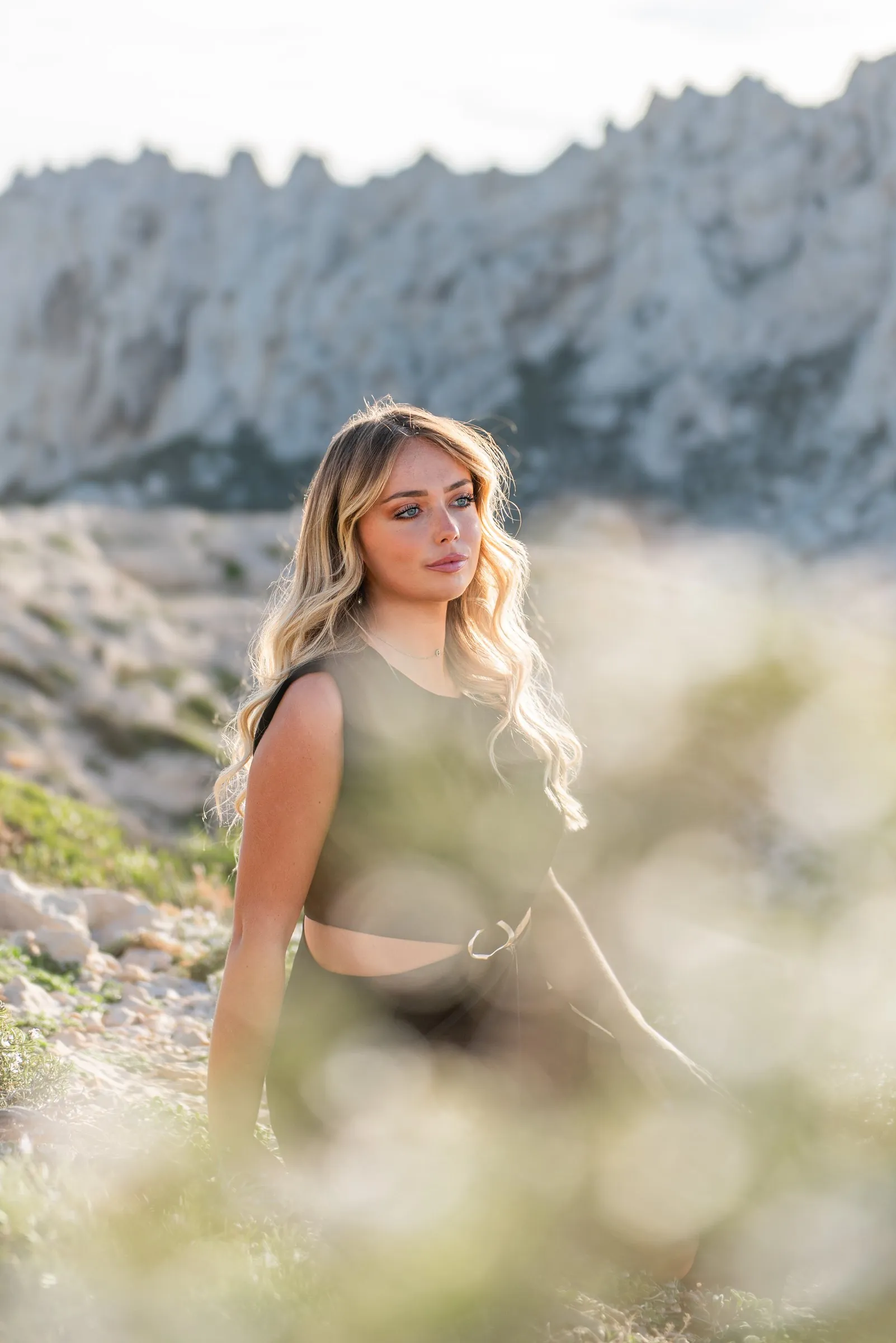 Portrait session at Les Goudes, facing the limestone cliffs of the Marseille calanques in soft late-day light